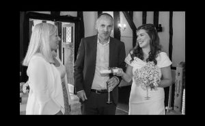 Joanne Jefferis celebrant and bride and groom on receipt of wedding scroll